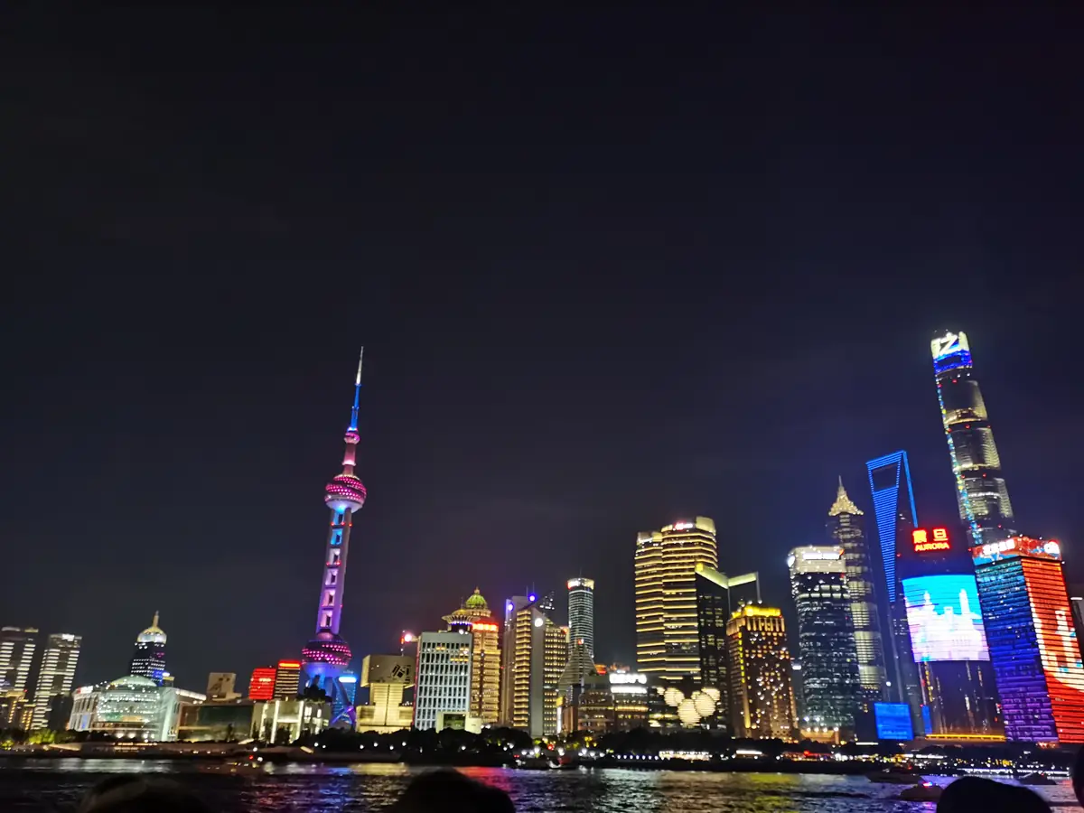 Oriental Pearl Tower and the illuminated Pudong skyline seen across the river from the Bund