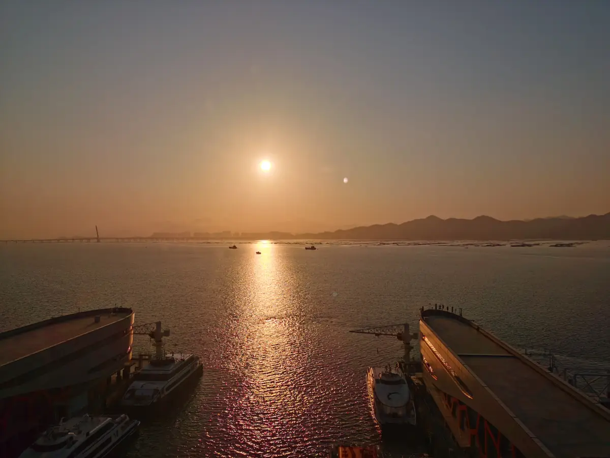 Sunset over the water and piers at Shekou harbor in Shenzhen